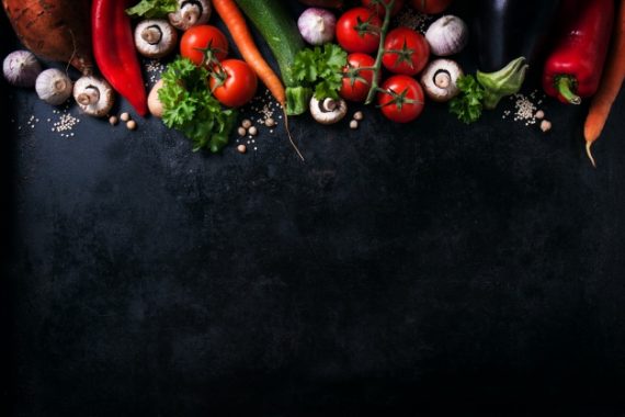 various-vegetables-black-table-with-space-message_1220-614