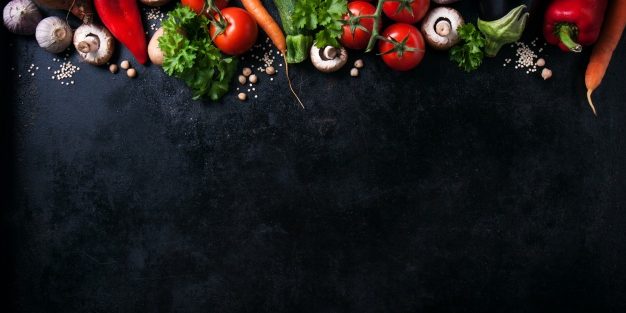 various-vegetables-black-table-with-space-message_1220-614